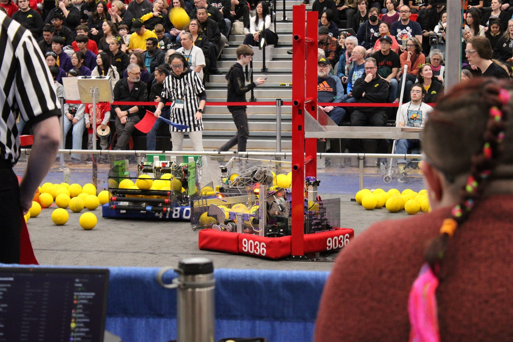 Mochi robot 9036 positioned under the red field structure during competition